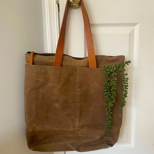 Brown waxed canvas and leather tote bag